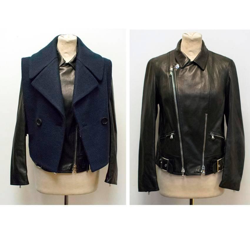 3.1 Phillip Lim black leather jacket with a detachable Navy wool Gilet. The leather jacket is long sleeves and features a regular collar, asymetric front zipper, silver hardware buckles and zips. The gilet is double breasted with a wide collar and