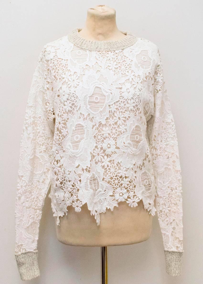 See by Chloe grey jumper with white crochet lace overlay, featuring a grey knitted crew neckline, cuffs and back. Medium weight jumper with a relaxed fit and jagged hemline. Size XS.

Made in the UK. Condition - 9.5/10

Approximate