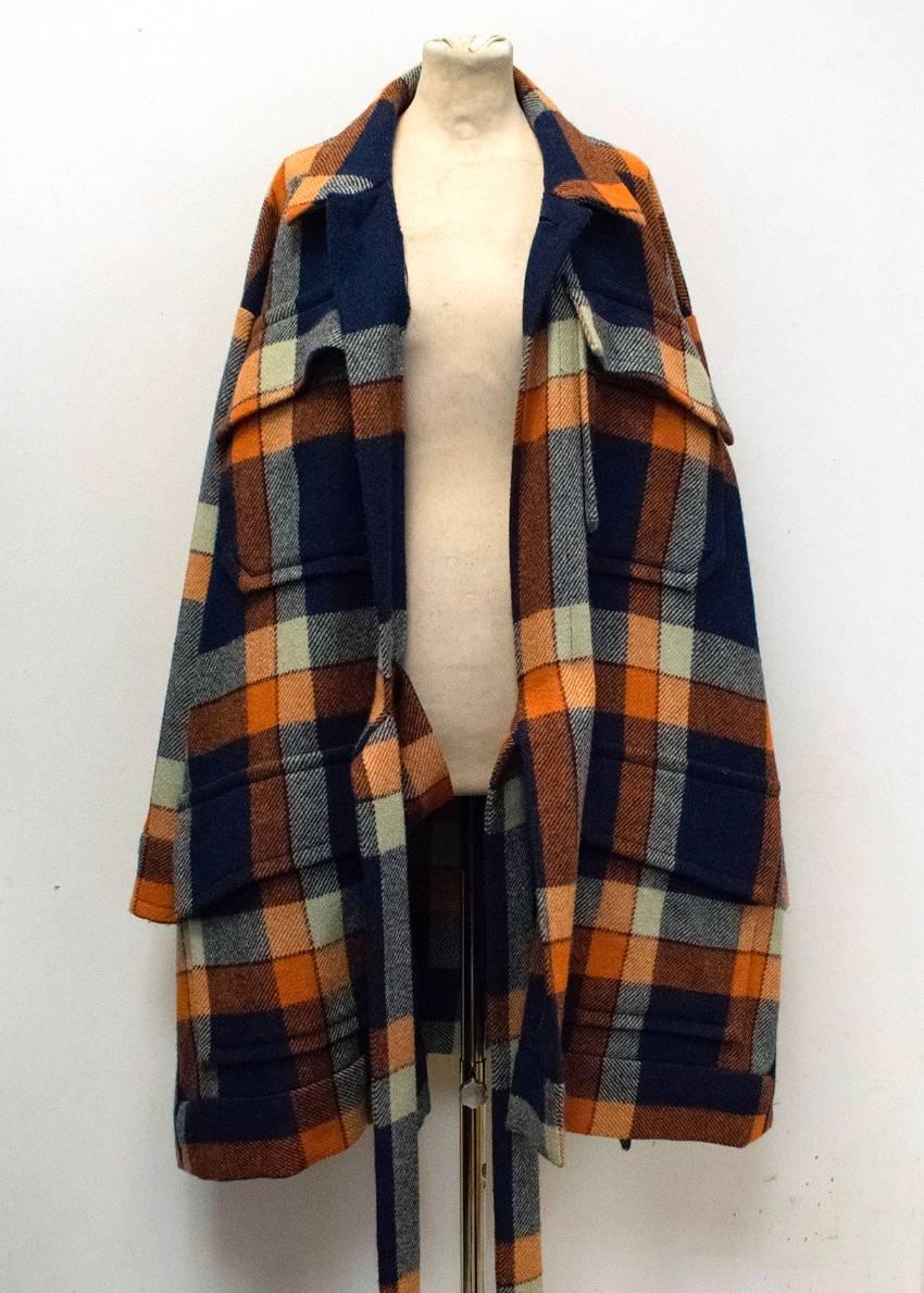 Vivienne Westwood gold label unisex cape style coat in an orange and blue tartan harris tweed. Features 4 oversized pockets on the front, a tie to the middle and translucent brown buttons. 

Condition: 10/10

Approx measurements: Shoulders -