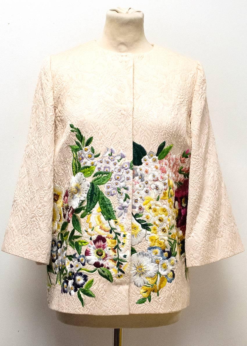 Dolce & Gabbana Pale Pink Floral Embroidered Jacket. The jacket is fully-lined and features centre front dome fastening and embroidered front & back.The dress is in great condition. 

Condition: 9/10

Made in Italy. 
The care label has been