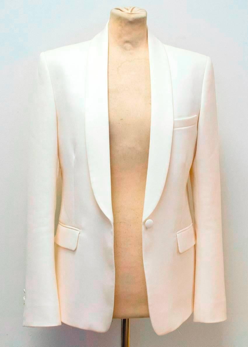 Balmain cream slim-fitting, single breasted blazer/dinner jacket. It features a shawl lapel, single vent, covered buttons, three exterior pockets and three interior pockets. 

Conditions Details : There are some small marks on the blazer which are