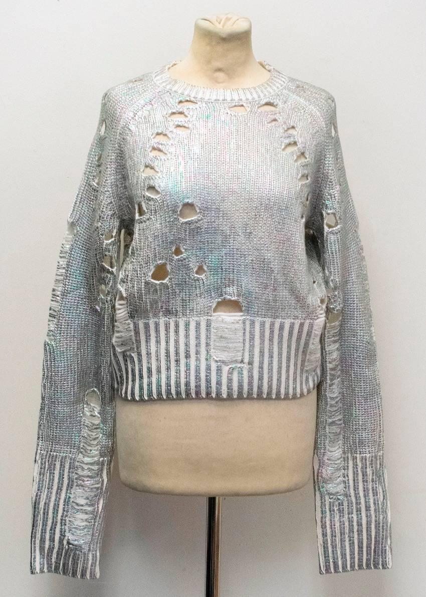 Zoe Jordan cropped white distressed sweater with an iridescent foil finish. Features a round neck and ribbed neckline, cuffs and hem. 

Condition: 10/10

Approx measurements:
Shoulders - 35cm 
Chest -50cm 
Waist - 39.5cm 
Sleeve Length -