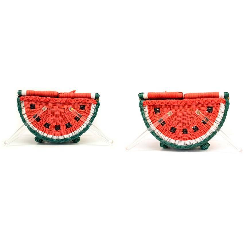 Charlotte Olympia multicoloured watermelon basket bag with transparent handles and Charlotte Olympia written on them. Opens with two center flaps, lightweight, stays in place when placed on an even surface.
Item comes with original dust bag and