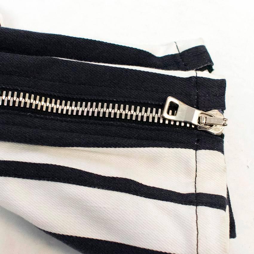 Balmain black and white vertically striped, low rise, skinny jeans with silver zips on the ankles and pockets. They feature three front pockets and two back pockets. 

Condition: 10/10
US  size 4 and the mannequin is a UK size 8-10 and US size