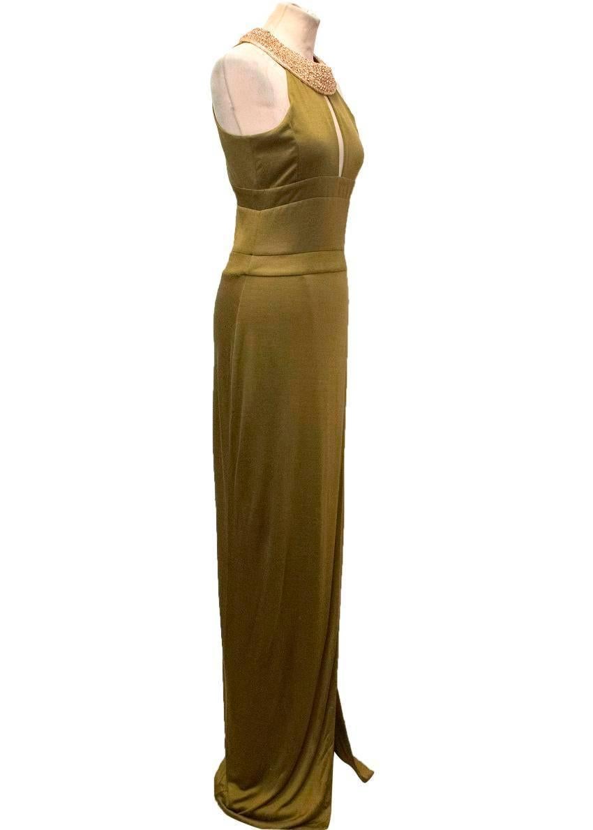 Balmain khaki, slim fitting, sleeveless gown. It features a gold embellished neckline, keyhole detailing on the bust and a layered slit style on the front of the skirt. 

There are some very minor pulls on the fabric towards the bottom of the