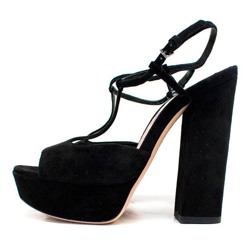 Miu Miu black suede block heeled and open-toed sling back sandals on a platform with a thin suede strap. 

Condition: 9.5/10 

Conditions Details : Some minor marks on the soles.

Approx measurements: 
Heel: 14 Cm 
Platform:3 Cm 
Shoe