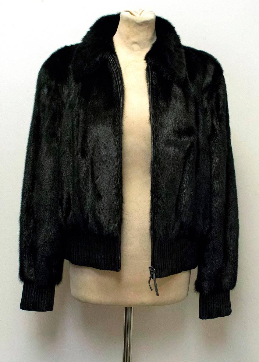 Yves Salomon black mink fur bomber style jacket with a classic collar, stitched leather hem and cuffs and leather trim along the zip. Fully lined. 

Condition: 10/10

Approx measurements: 
Length:57 Cm 
Sleeves: 61 Cm 
Shoulders: 46 Cm 
Bust: 56