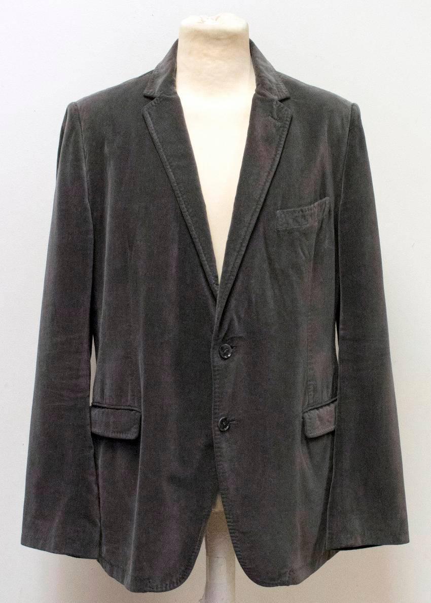 Dolce & Gabbana charcoal grey velvet blazer. Featuring a single breasted notch lapel with two grey buttons on closure, padded shoulders, a pocket on the left chest and two side pockets by the hem. Lined with viscose.

Approximate