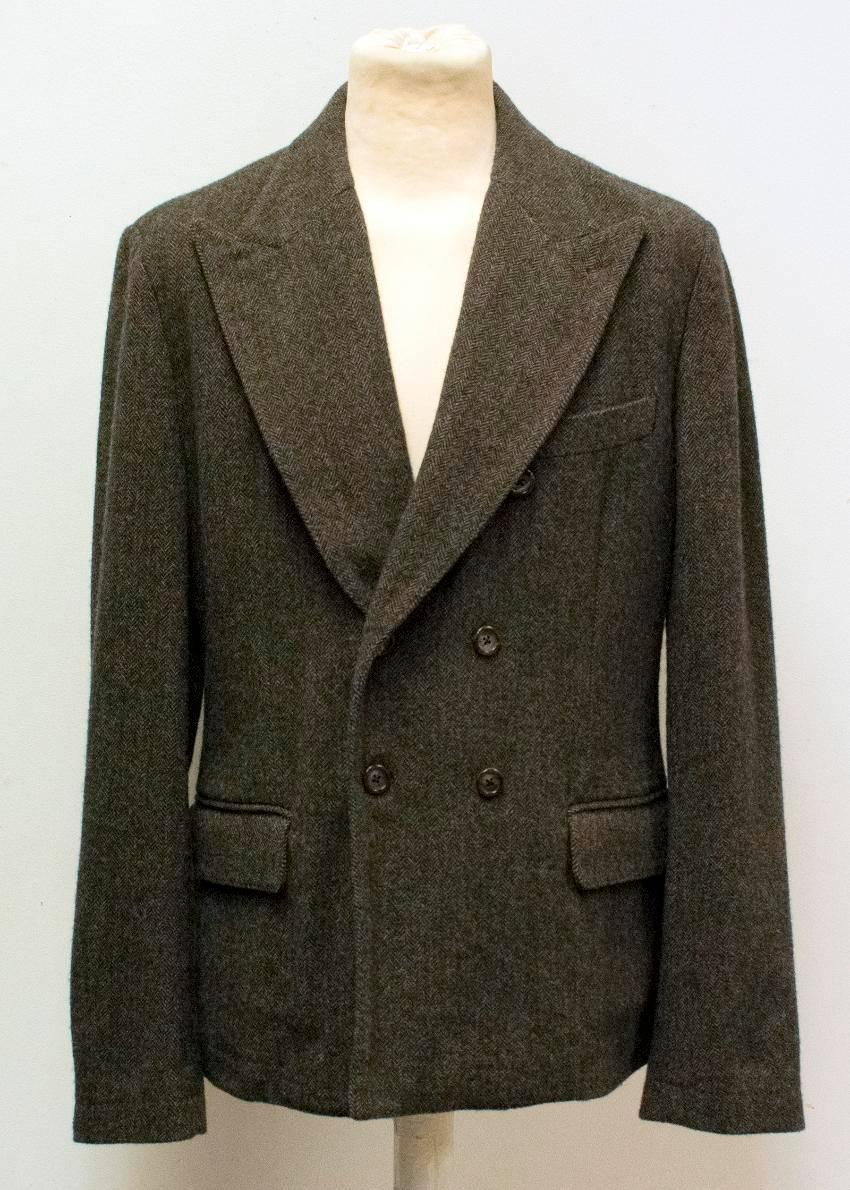 Dolce & Gabbana brown wool blazer. Double breasted wide peak lapel jacket featuring six brown buttons, a pocket on the left chest and two pockets by the waist. Vent at the back of the blazer. Medium weight blazer.

Condition - 10/10

Approximate