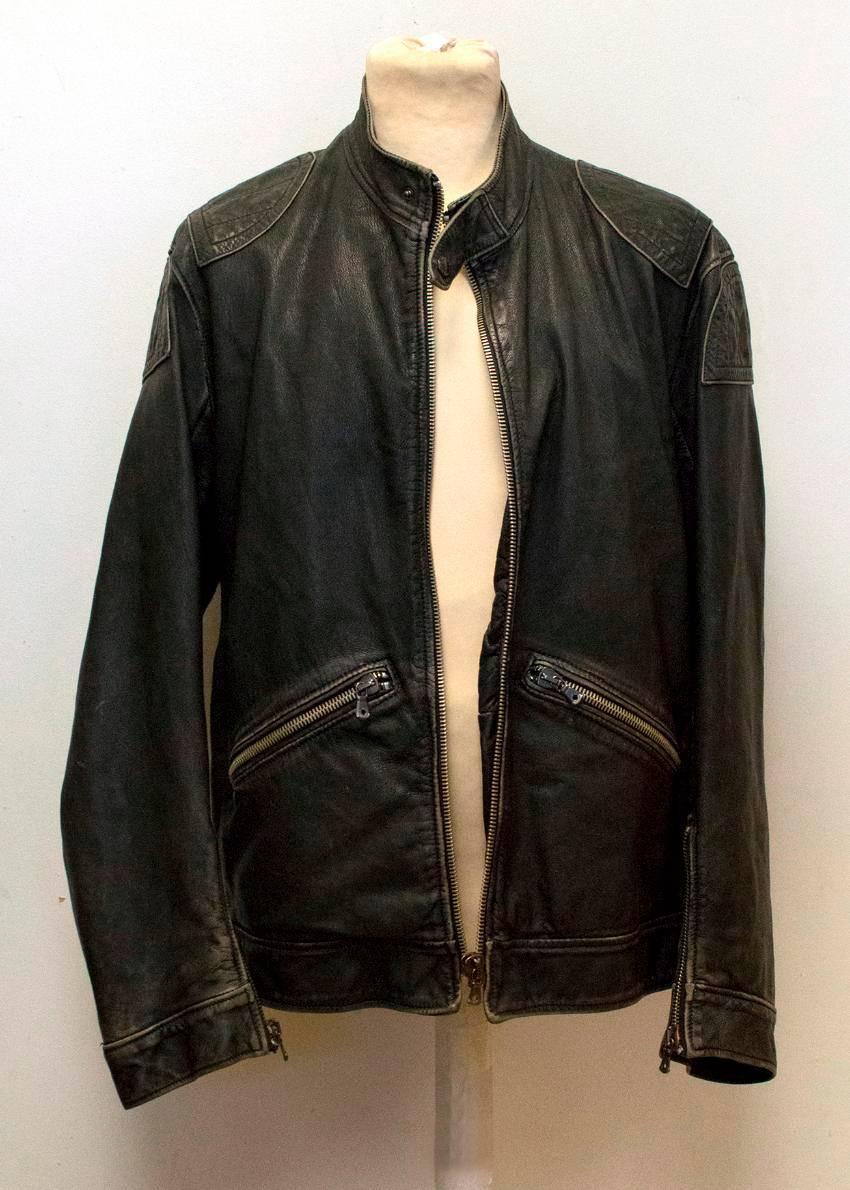 Dolce & Gabbana distressed black leather bomber jacket. It features gunmetal zip detailing, two exterior zip pockets and two interior chest pockets. 

The jacket is supposed to look distressed, however there are a few small marks on the leather upon