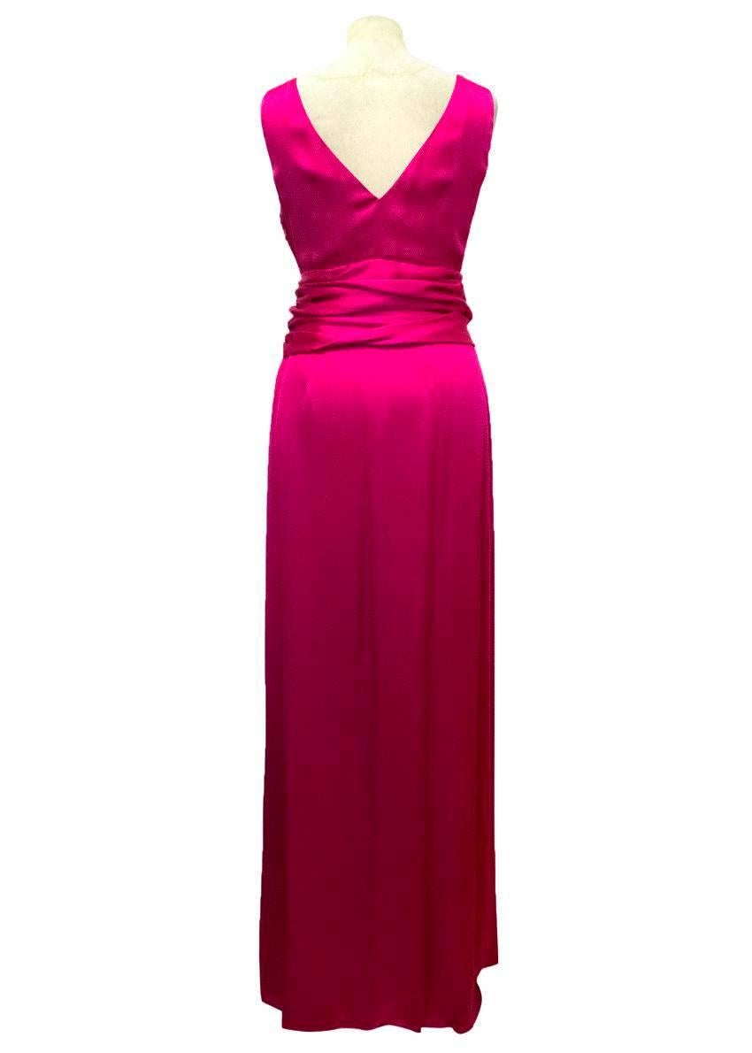 Christian Dior slim fitting, fuschia, silk ballgown. It is sleeveless with a v neckline and features draping and ruching around the waist. 

Excellent condition, a small mark on the interior slip. 

Condition: 9/10

Please note that there is no
