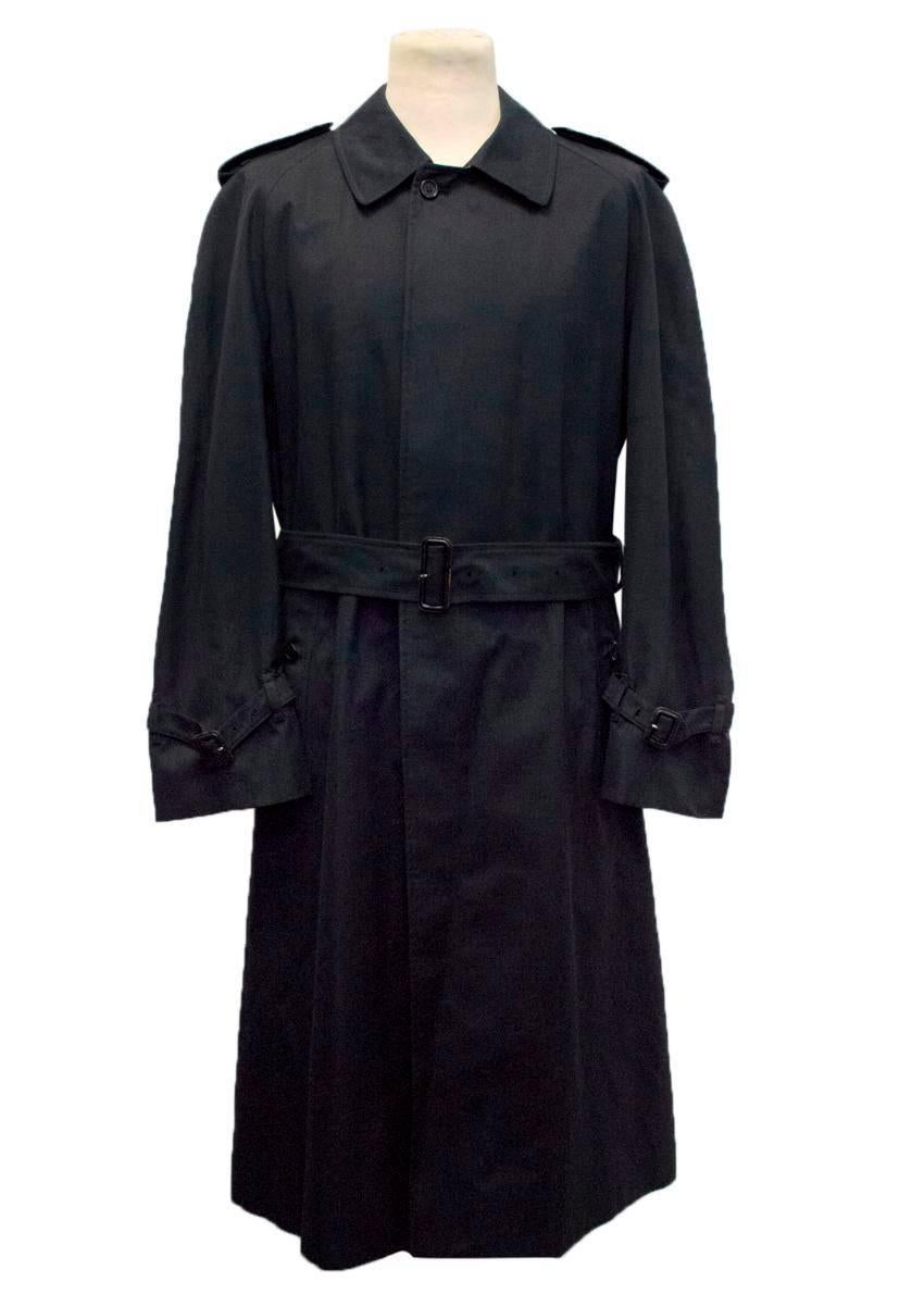 Burberry vintage navy blue long trench coat with Burberry navy and red checks on the lining. Features a spread collar, a removable waist belt, buttoned side pockets and navy buttons down the coat. There are side pockets on the inside lining.

Slight