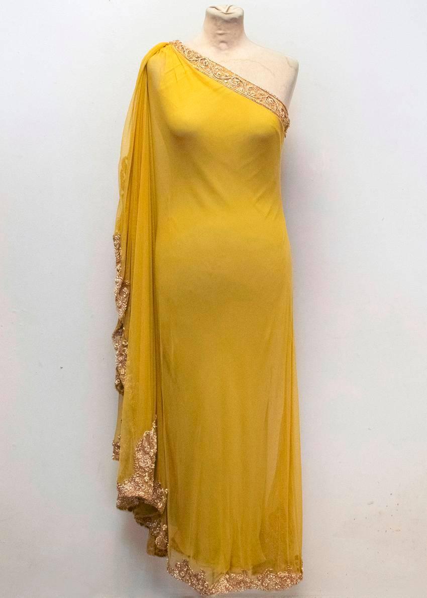 Marchesa yellow one shoulder embellished and mesh gown. This gown features a gold embellished top and bottom lining. The embellishments at the top are across the chest and down the shoulder fabric at the top. The shoulder features a loose fabric