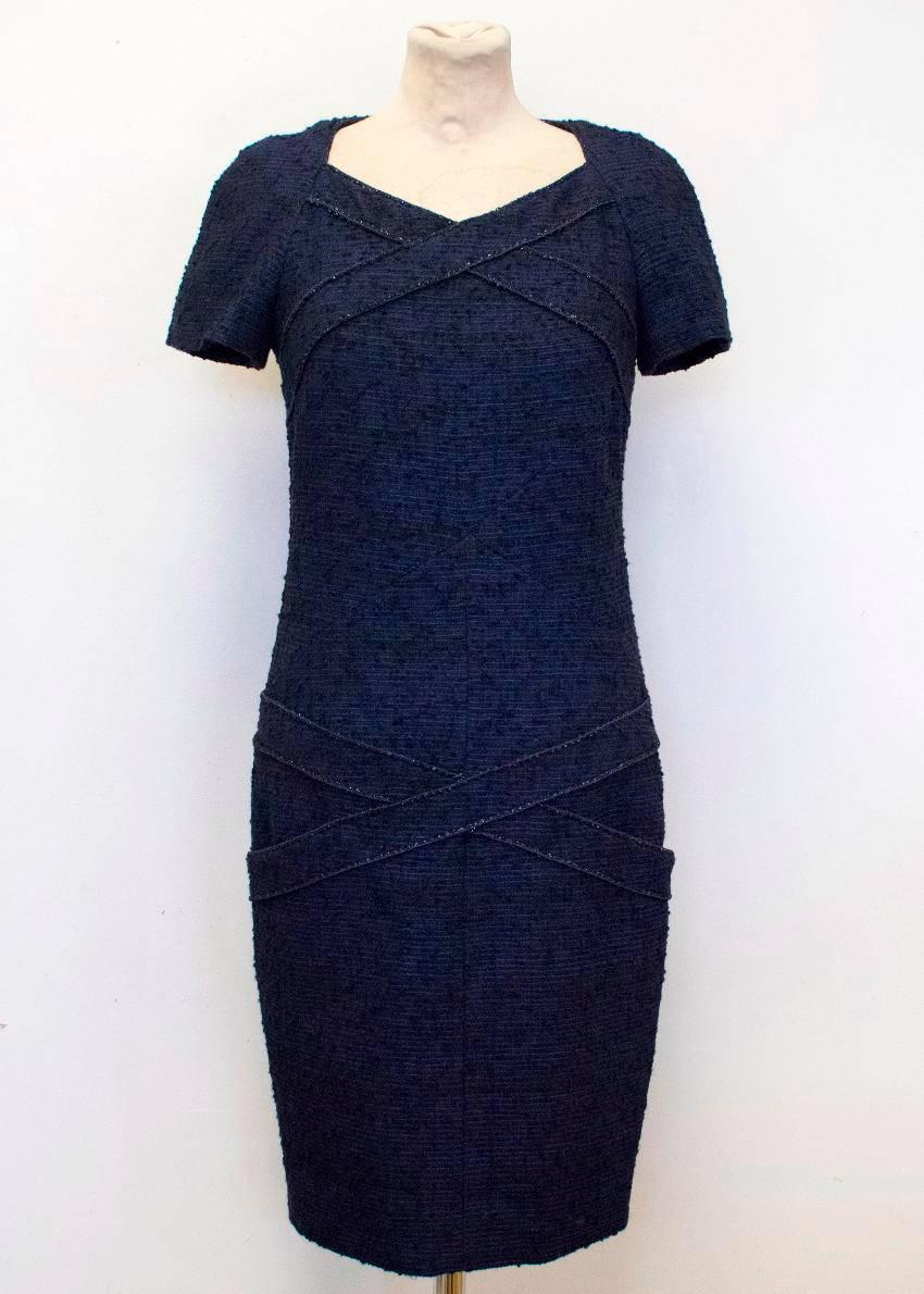 Chanel navy & black tweed wool blend pencil dress. This dress features criss-cross detailing on the top and at the hips. This is a short sleeve dress and has a concealed zipped at the back center. On the front, at the criss-crossing at the waist,
