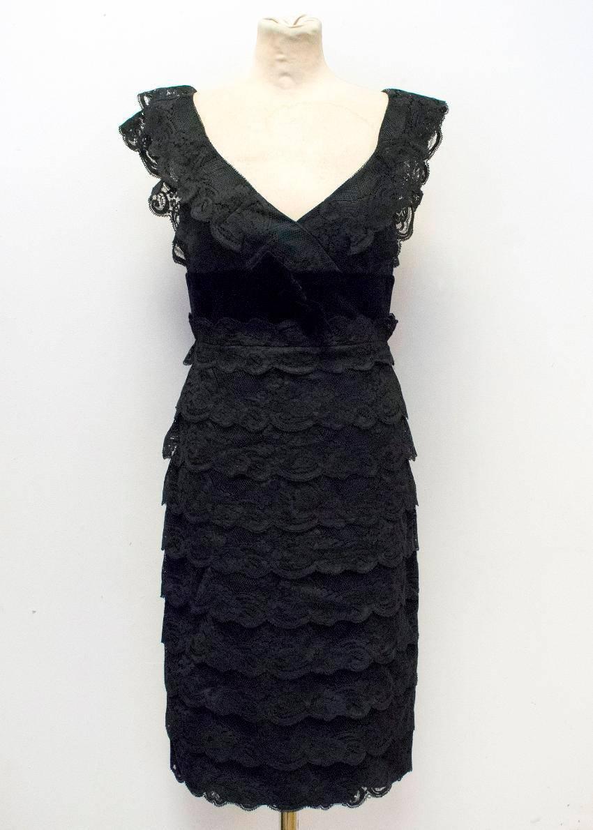Armani Collezioni black lace dress with velvet waist and bow. This dress is sleeveless and fully lined with a black attached slip. There is a velvet waistband with a velvet bow. The neckline features a v-cut. At the back center of the dress, there