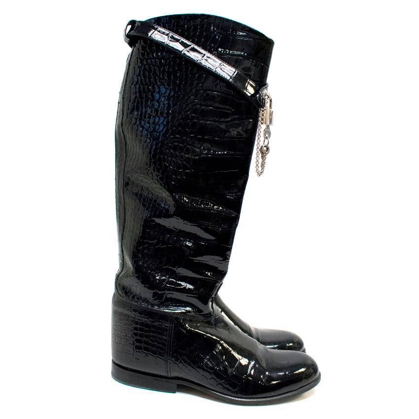 Dolce and Gabbana patent leather crocodile effect embossed tall flat boots with an ankle strap with a silver toned metal padlock and keys. 

Comes in the original box, however there is damage to the box. 

There are signs of wear on the soles and