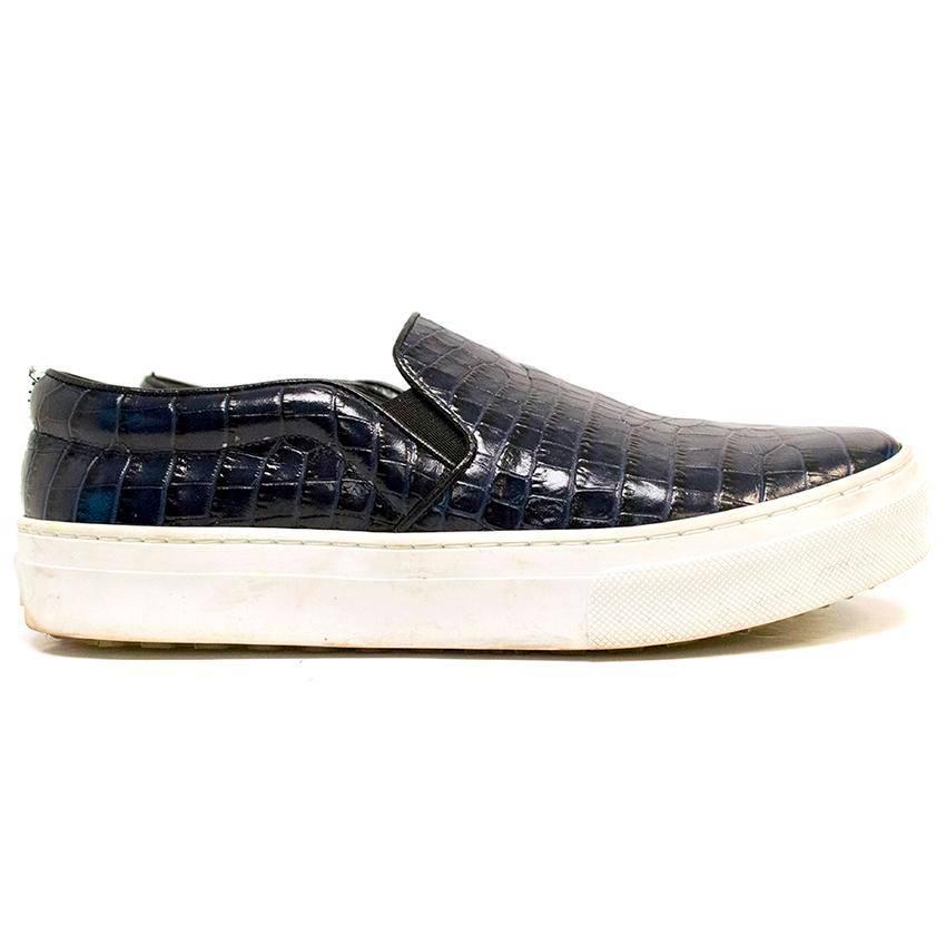 Celine dark navy blue patent mock croc skin slip on trainers with a thick white midsole and lined with dark navy leather.

Made in Italy. 

There are only very minor sign of wear on the white rubber, otherwise the shoes are in good