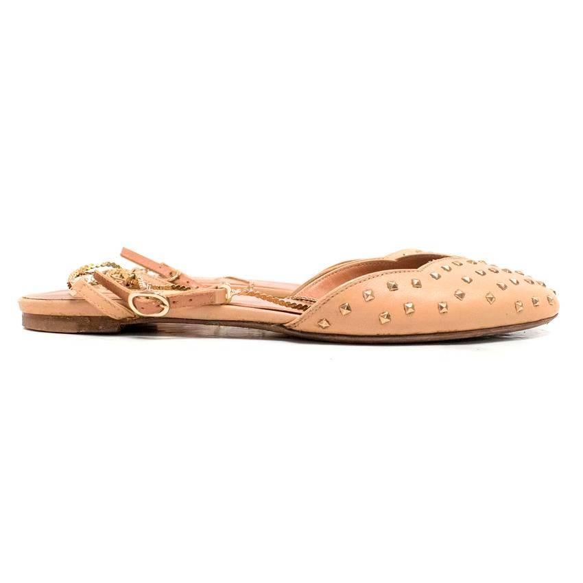 Valentino nude studded flat pumps. These feature studs on the main body of the shoes. At the ankles there are chains and a leather strap with a metal buckle. The interior lining is made of a mauve leather. 

Condition: 9/10 These shoes show signs of