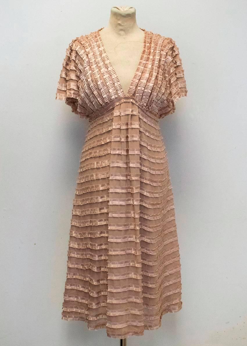 Temperley London midi length mauve silk dress with capped butterfly sleeves and an attached slip dress. The dress features textured ruched horizontal stripes and a v-shaped neckline. Fastens at the side with a concealed zip and a metal hook at the