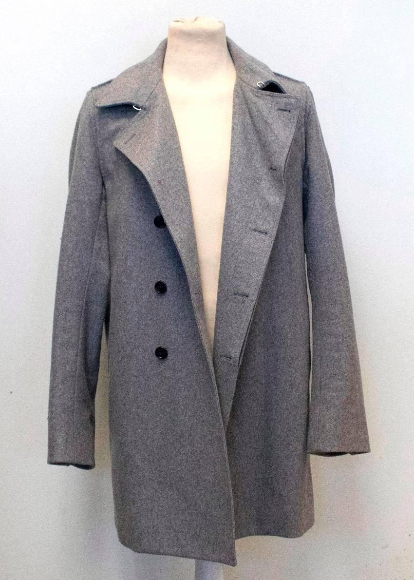 Dior men's grey wool coat with a peak lapel, two exterior and two interior pockets and a single vent.
Fastens at the front with black buttons. 
Fully lined. 

Condition:10/10 

Size: M
Size UK: 38
Size EU: 48

Measurements Approx.

length: 93