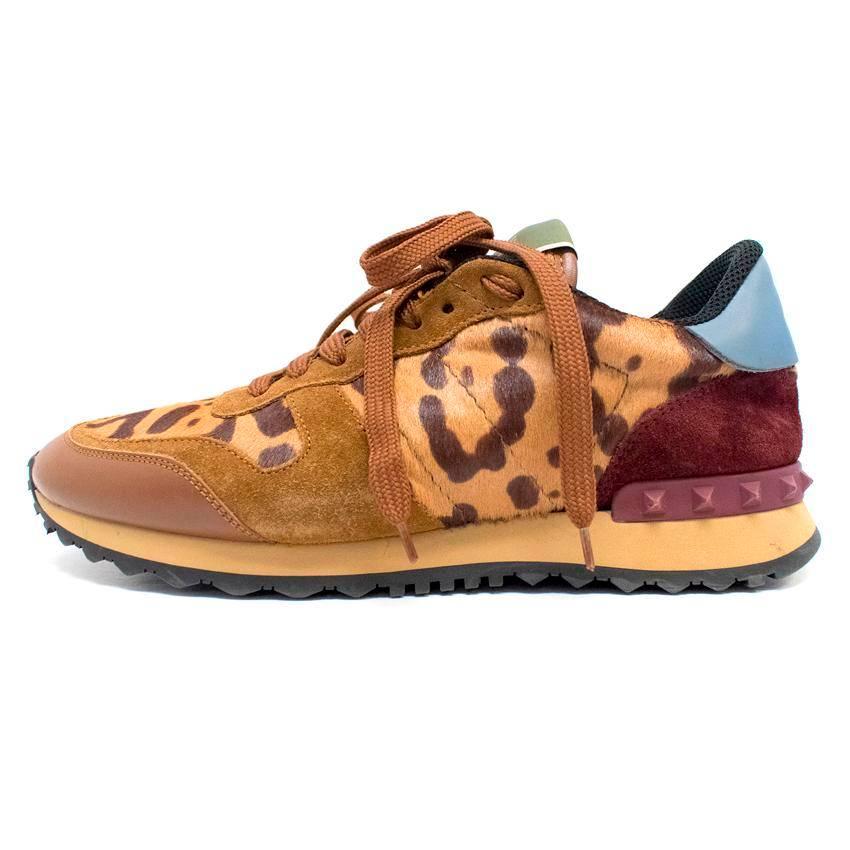Valentino Garavani pony hair leopard print rockstud trainers  with suede and leather inserts and burgundy rubber studs at the back. 

There are minor signs of wear  to the exterior and minimal wear to the soles.

Condition: 9/10 

Size IT: 38
Size