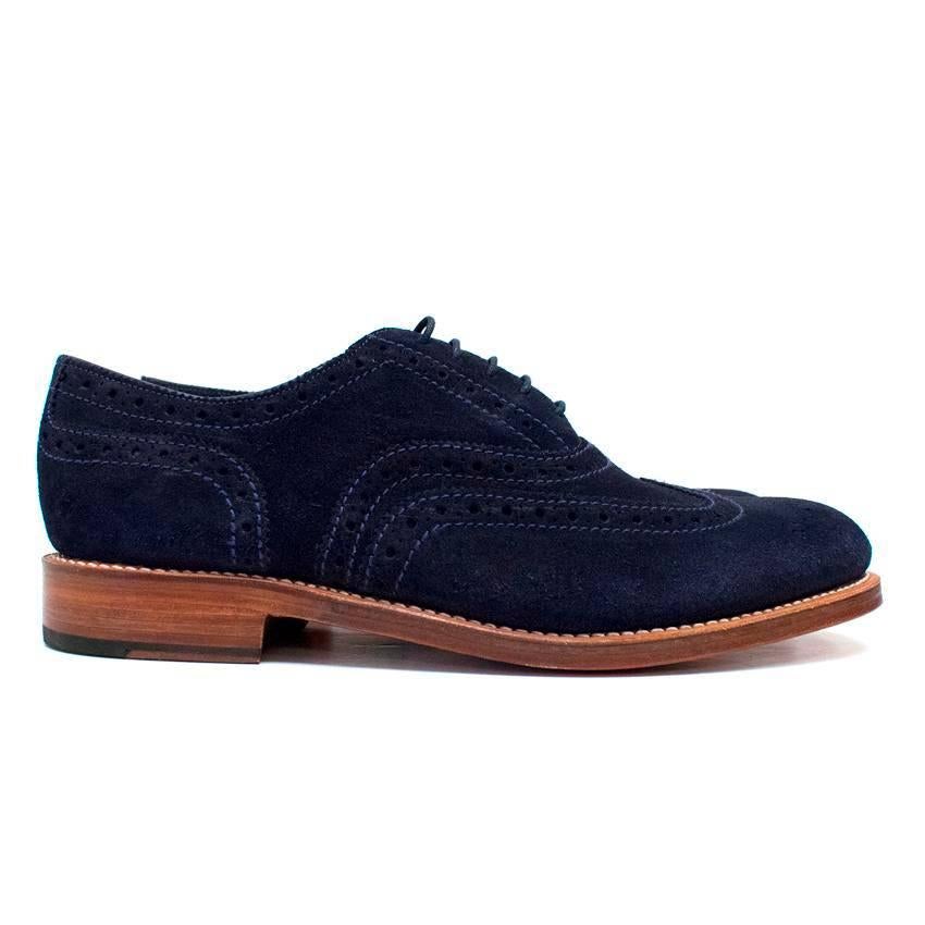 Grenson men's navy suede brogues with a blue stitching and lazer cut out details.
Feature thin navy laces and tan wooden soles.
Line with red leather. 

The shoes are never worn, however there are minor marks on the soles from trying the shoes on.