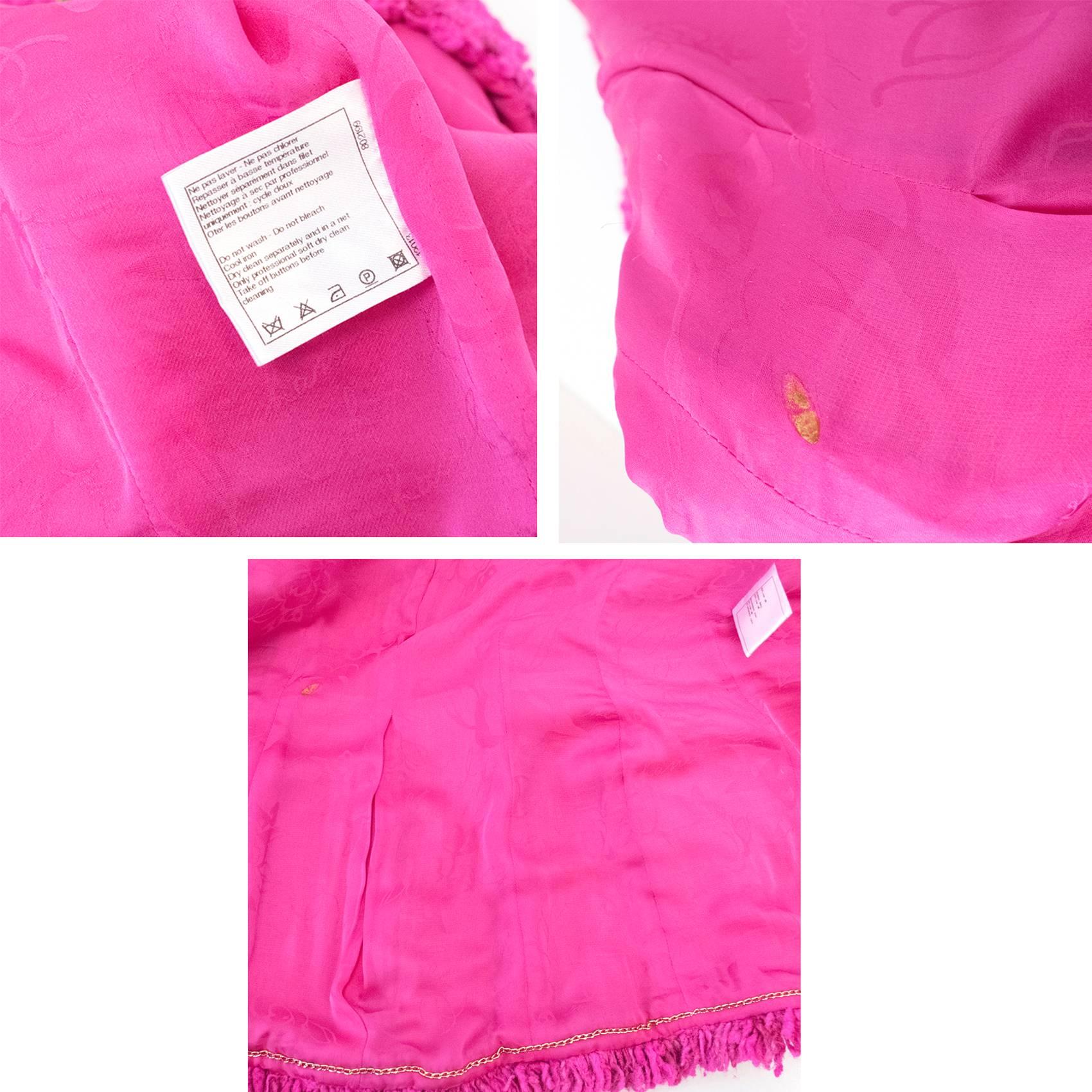 Chanel Fuschia tweed jacket from the pre-fall 2012 Paris - Bombay collection.The jacket is medium weight and fully lined with a mandarin collar, white removable cuffs and has a cropped cut-out at the front. Four, gold button closure encrusted with