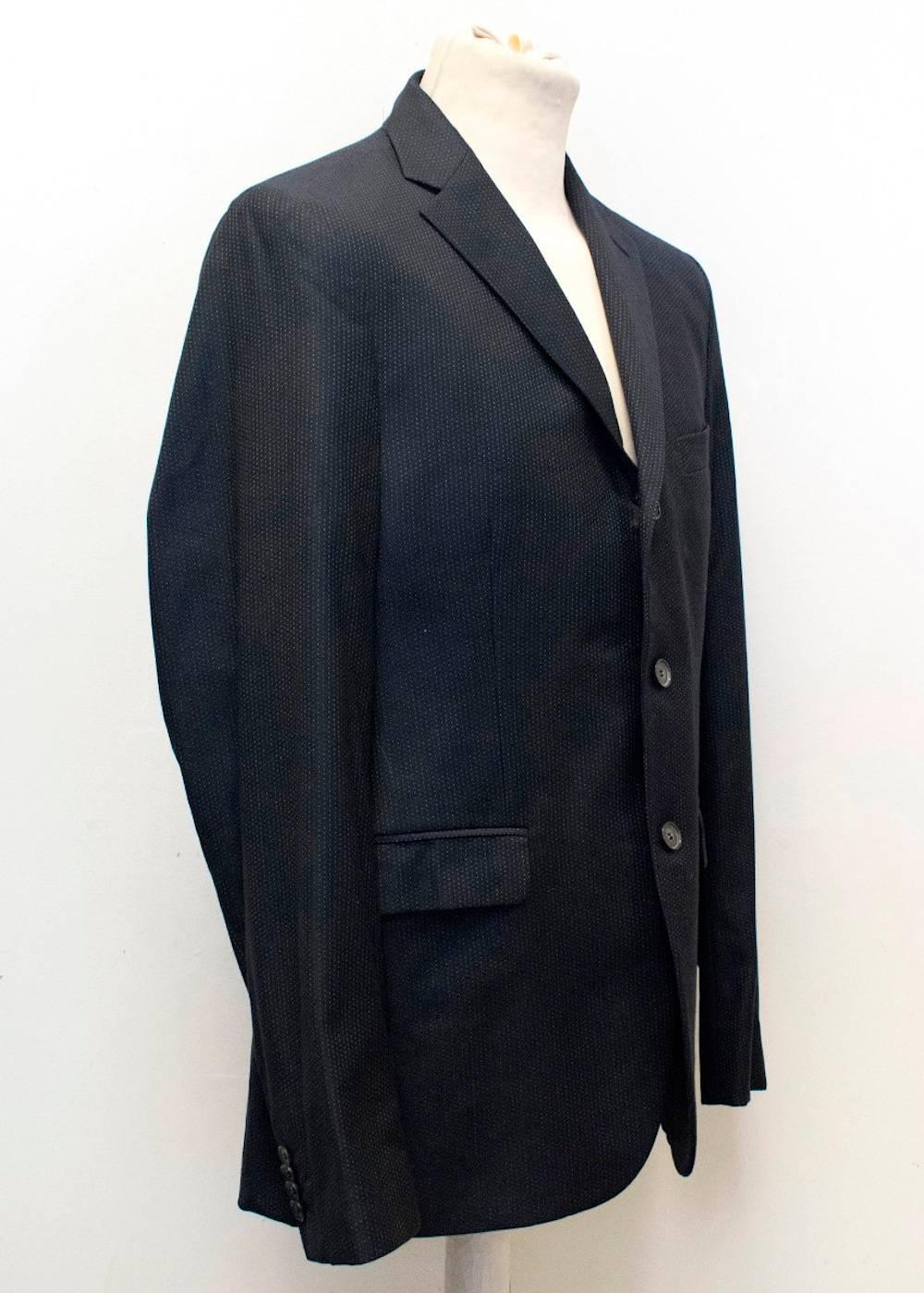 Acne men's navy blue jacket and trouser  with white pinpoint print. The jacket is fully lined and includes notch lapel, two vents at the back, diagonal chest pocket, two pockets at the front. The trousers feature a small v detail at the top back and