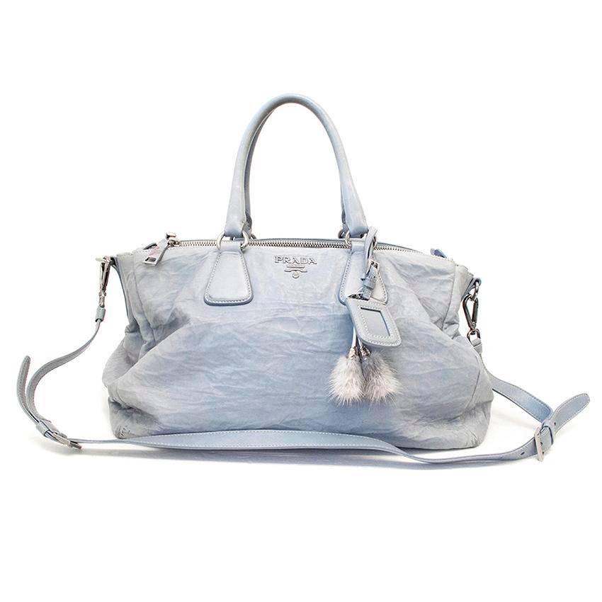Bird egg blue Vitello Shine leather tote bag. Double zip and press stud fastening. Multiple compartments. Detachable strap. Nude leather lining. Made in Italy. 

Condition: 7.5/10. The exterior leather is slightly creased and there are some marks on