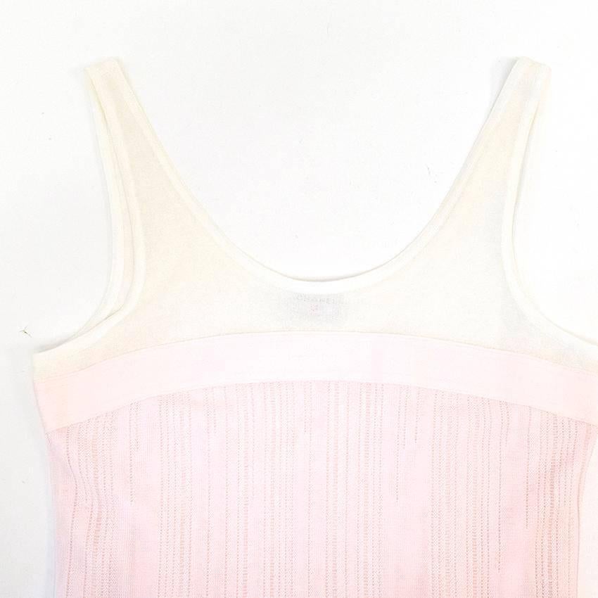 Sleeveless pink and white dress with distress details and chiffon hem. Made in France. Soft dry clean only. 

Great condition, 9/10. There are tiny pulls in the pink fabric due to its delicate nature, however this is not visible when worn.

Size FR:
