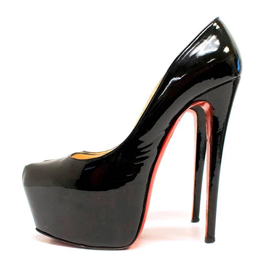 Christian Louboutin black patent leather stiletto pumps with pointed toes and concealed platforms. 

The leather has a few scratches and creases upon close inspection and the soles and insoles are marked, however this is barely noticeable when worn.