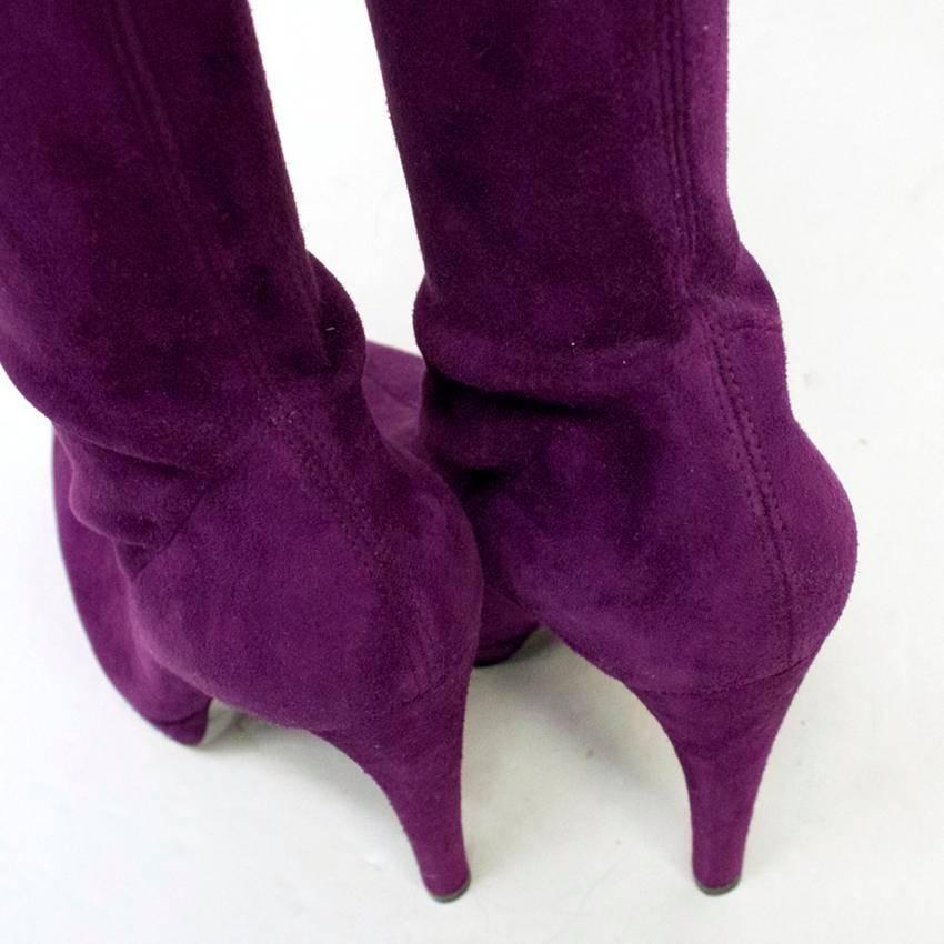 Casadei purple suede thigh high sock boots with pointed toe and small platform.

Made in Italy.

Item is new and unworn, there is a slight mark to the toe and back heel of the left boot, only visible upon close inspection, from storage.

Please note