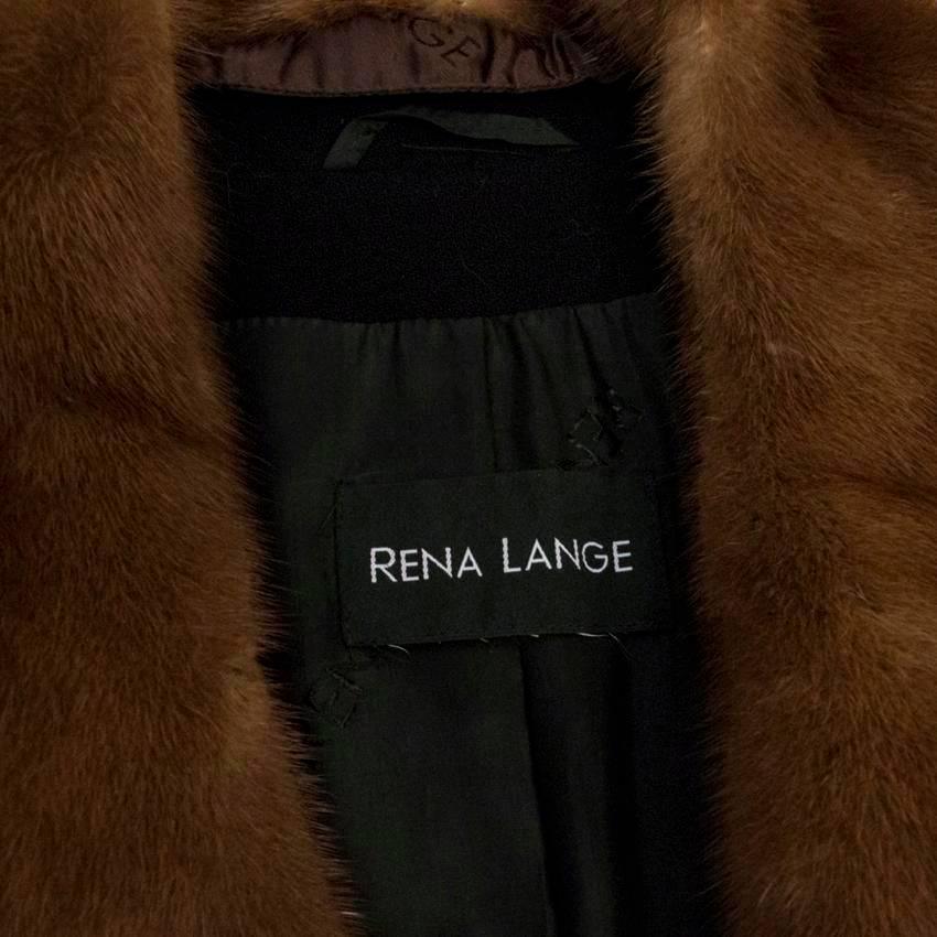 Rena Lange black wool long coat featuring a brown mink fur collar, two flap pockets with three rouleau loops for fastening at the front.

Please kindly note that this coat is lightweight

Condition: 10/10

Size DE: 36
Size UK: 10
Size US: