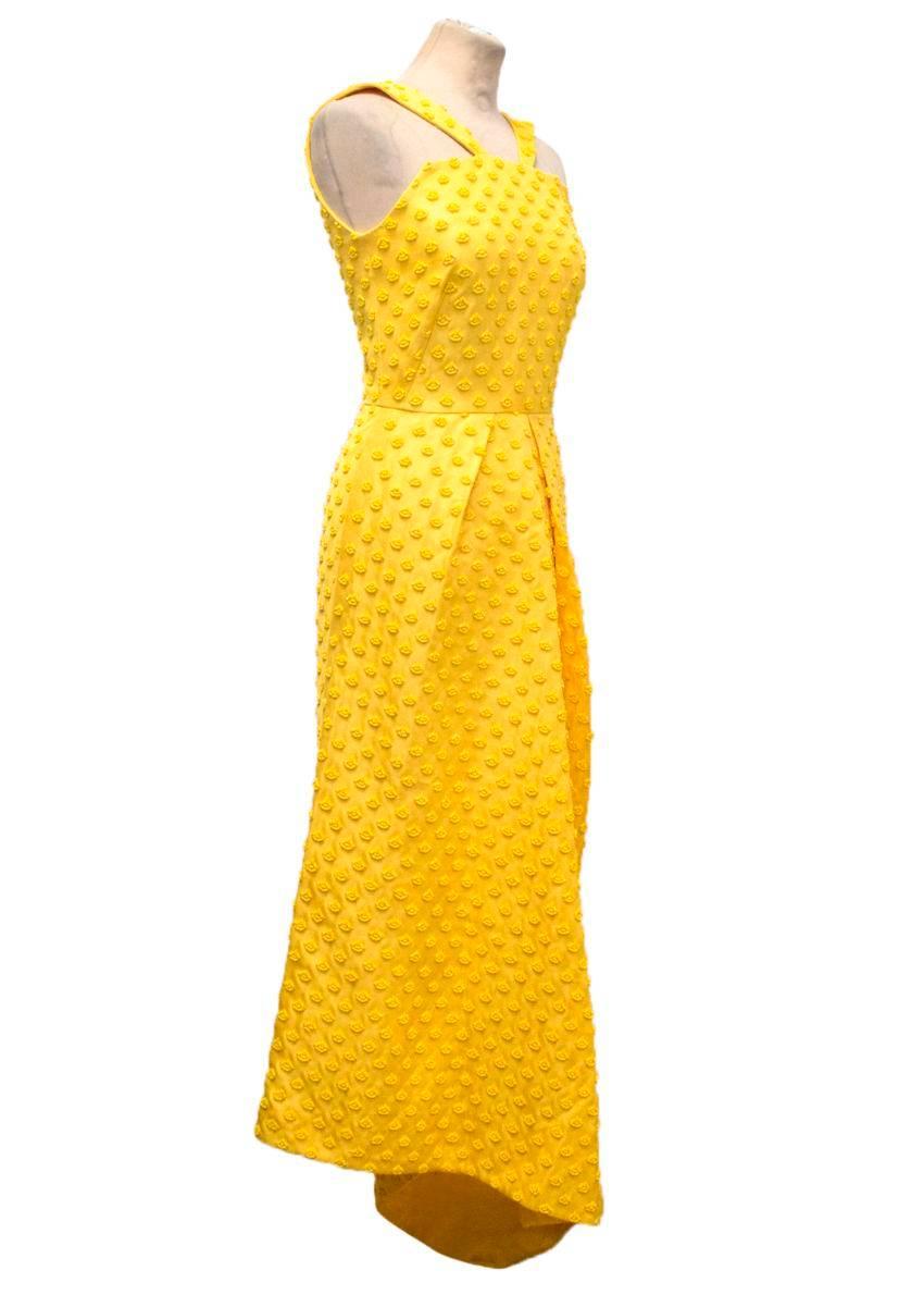 Osman A/W14 yellow asymmetric calf length dress with yellow beading, two pleats in the front, long yellow invisible zip fastening and is fully lined. Small black mark on the back of dress near the bottom of the zip. Slight black markings on the