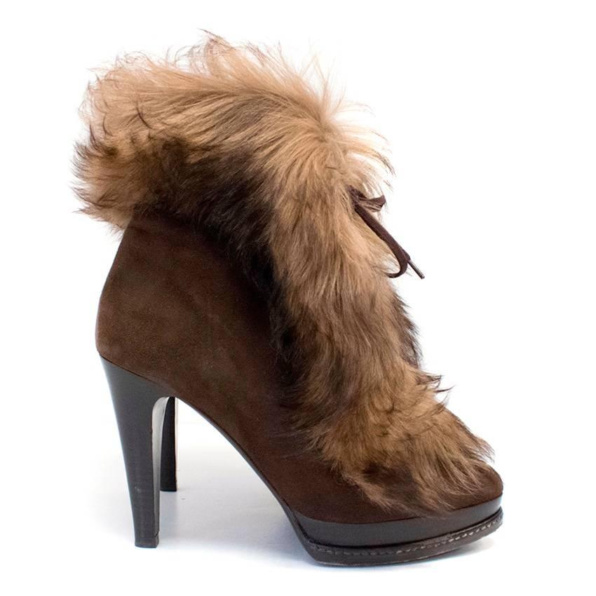 Ralph Lauren brown shearling lamb detail ankle boots with stiletto high heels. Features, brown lace up front closure, wood effect heel and platform with stitch detail on platform. 

Normal wear to the soles  please see images, otherwise in good