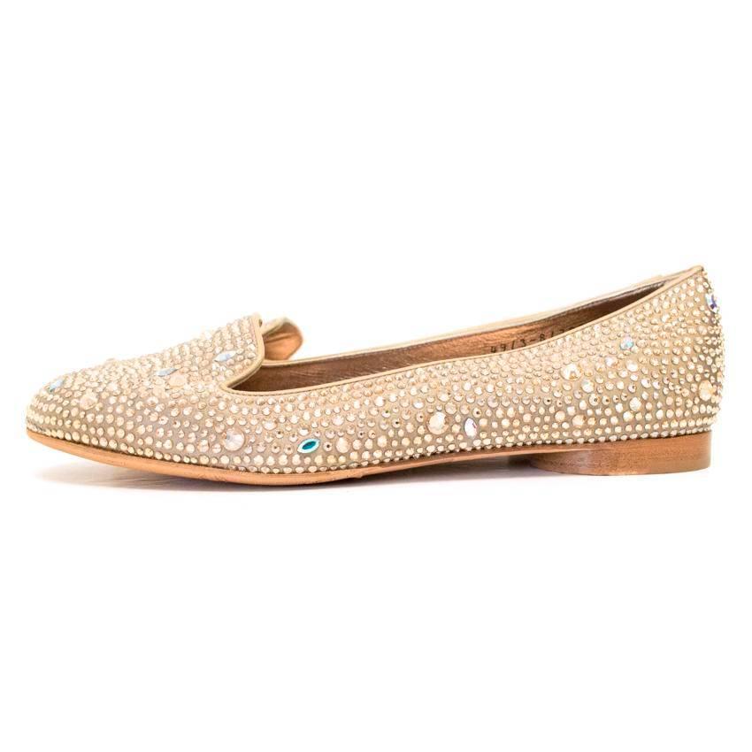 Champagne satin pumps embellished with Swarovski crystals. Kindly note grip pads have been added to the soles of these shoes.

Condition: Hardly ever worn 9.5/10

Made in England. 

Size IT: 38
Size UK: 5
Size US: 8

Measurements Approx: 
width -