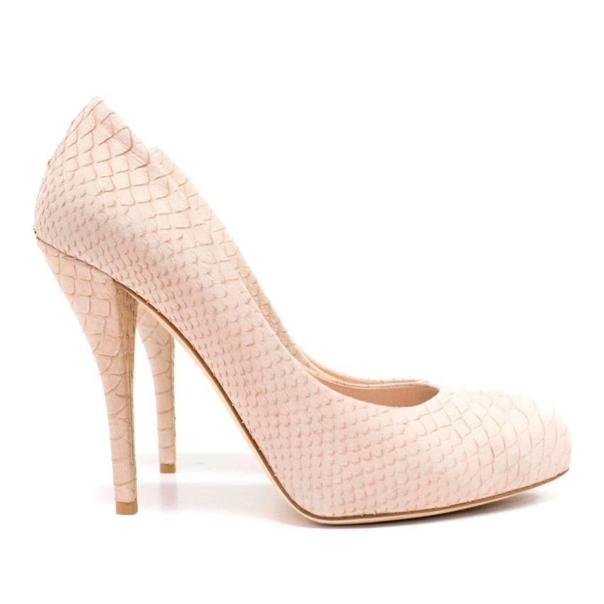 Christian Dior nude pink suede, high heeled pumps with a snakeskin effect. Feature rounded toes and a silver toned metal Dior logo at the back of the shoes. 
Lined with nude leather. 

There is normal wear to the soles and a minor mark on the sole
