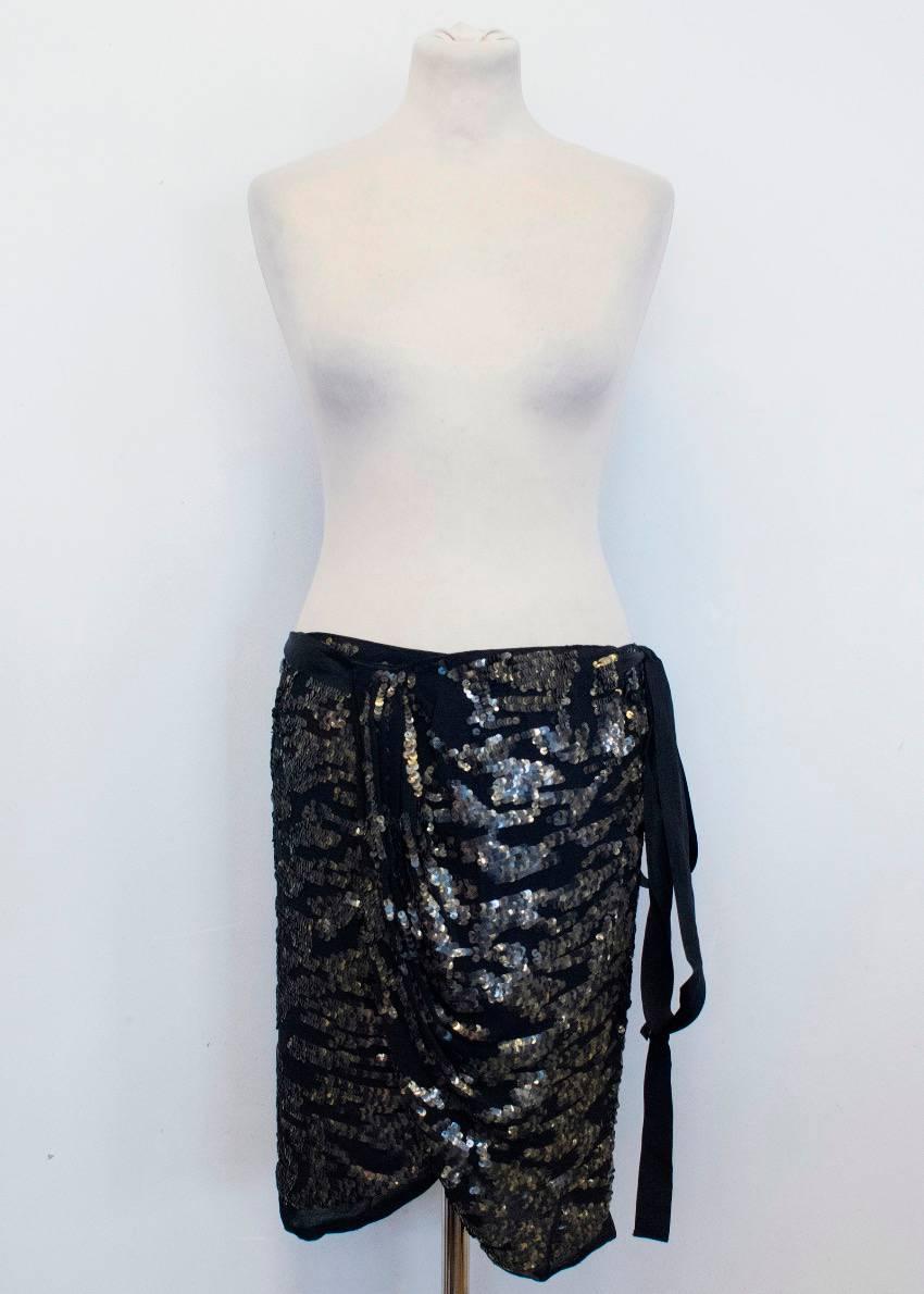 Isabel Marant Felmira black wrap around silk mini skirt. Features, sequin embellishments and draped detail. Fastens with wrap around tie. 

Condition: 10/10

Size: M
Size EU: 40
Size UK: 12
Size US: 8

Measurements Approx.
Measured when skirt is