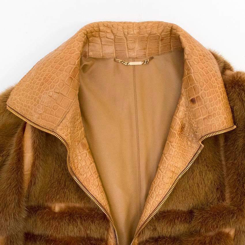 Gucci brown mink long coat with crocodile leather. Coat also features  a gold zip and leather lining.

Due to the nature of the leather there are some natural marks to the inside crocodile leather.

Made in Italy.

Condition: 10/10

Size: M
Size EU: