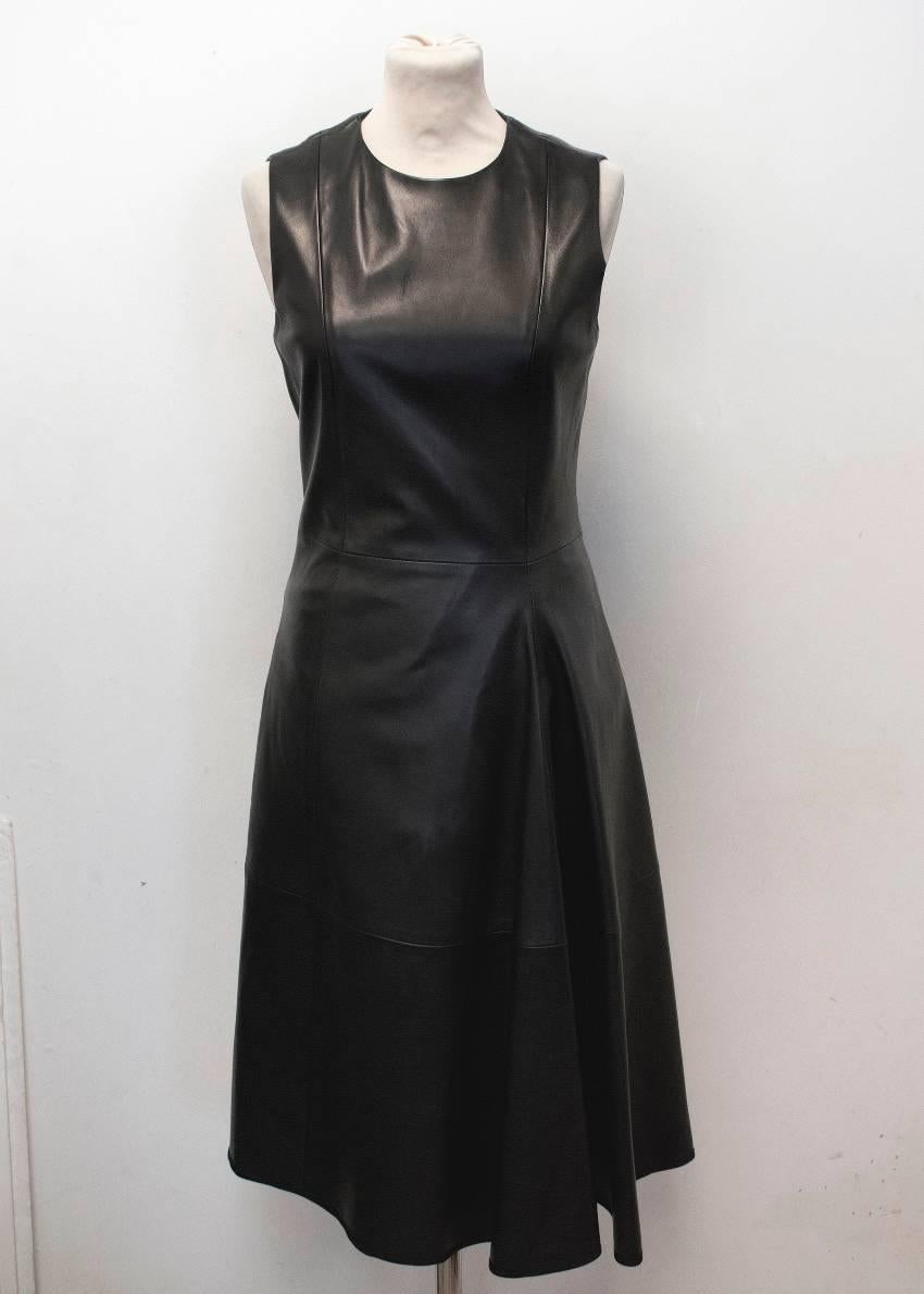 The Row lambskin black sleeveless dress. Features, rounded neckline, fitted bodice, calf length flare skirt, a discreet back zip and front side pleat detail. Lined in 100% Silk.

Condition: 10/10

Size: XS
Size US: 4
Size UK: 8

Measurements