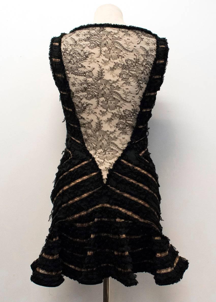 Dsquared2 black sleeveless textured lace mini dress. Features, a boat neckline, black bow details down the front of the dress, visible nude lining, a flared hem, sheer lace low back panel. Fastens with a discreet side zip.

There are faint water