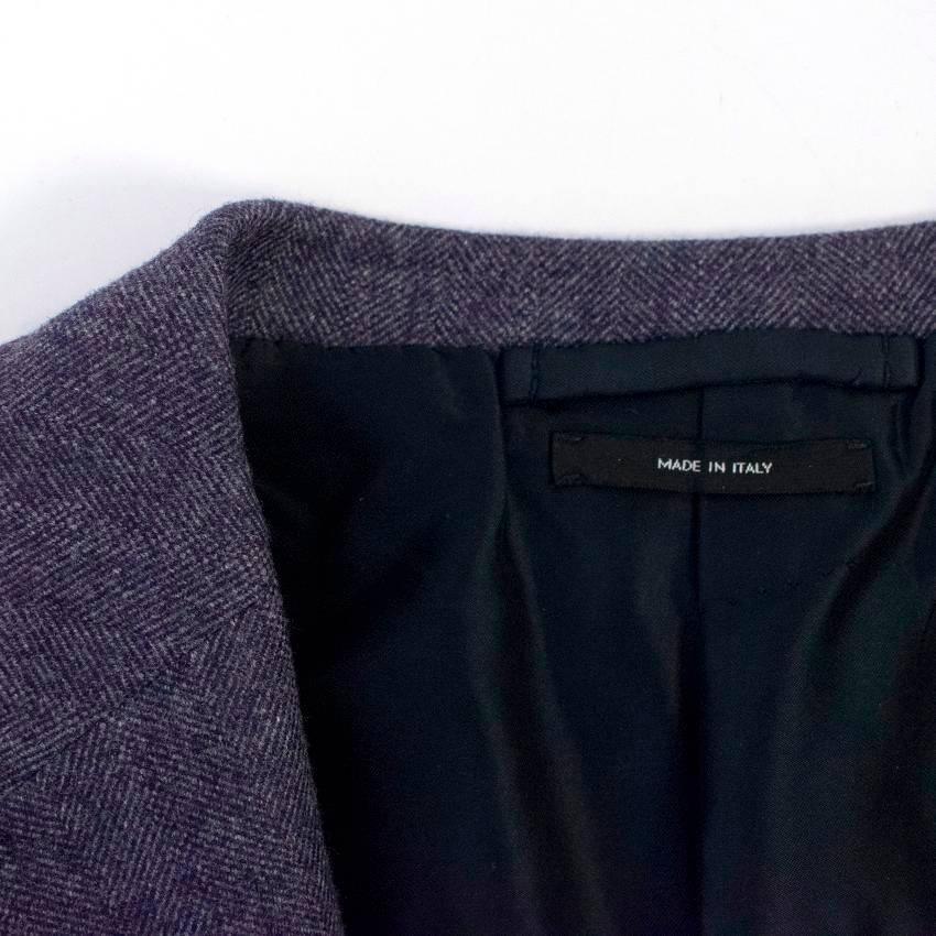 Tom Ford men's wool and cashmere blend purple  blazer. 

The blazer features: 
- notch lapel
- three exterior pockets
- four interior pockets
- single vent
- three front buttons
- five button cuffs
- partially lined with black silk and rayon blend