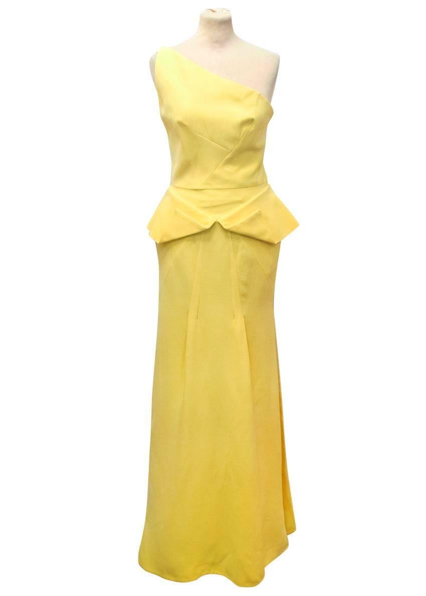 Roland Mouret yellow one shoulder gown. The dress is tailored and features a geometric peplum detail around the midsection. The dress is medium weight and features a single shoulder strap at the back in nude silk. 
Fully lined with silk and fastens