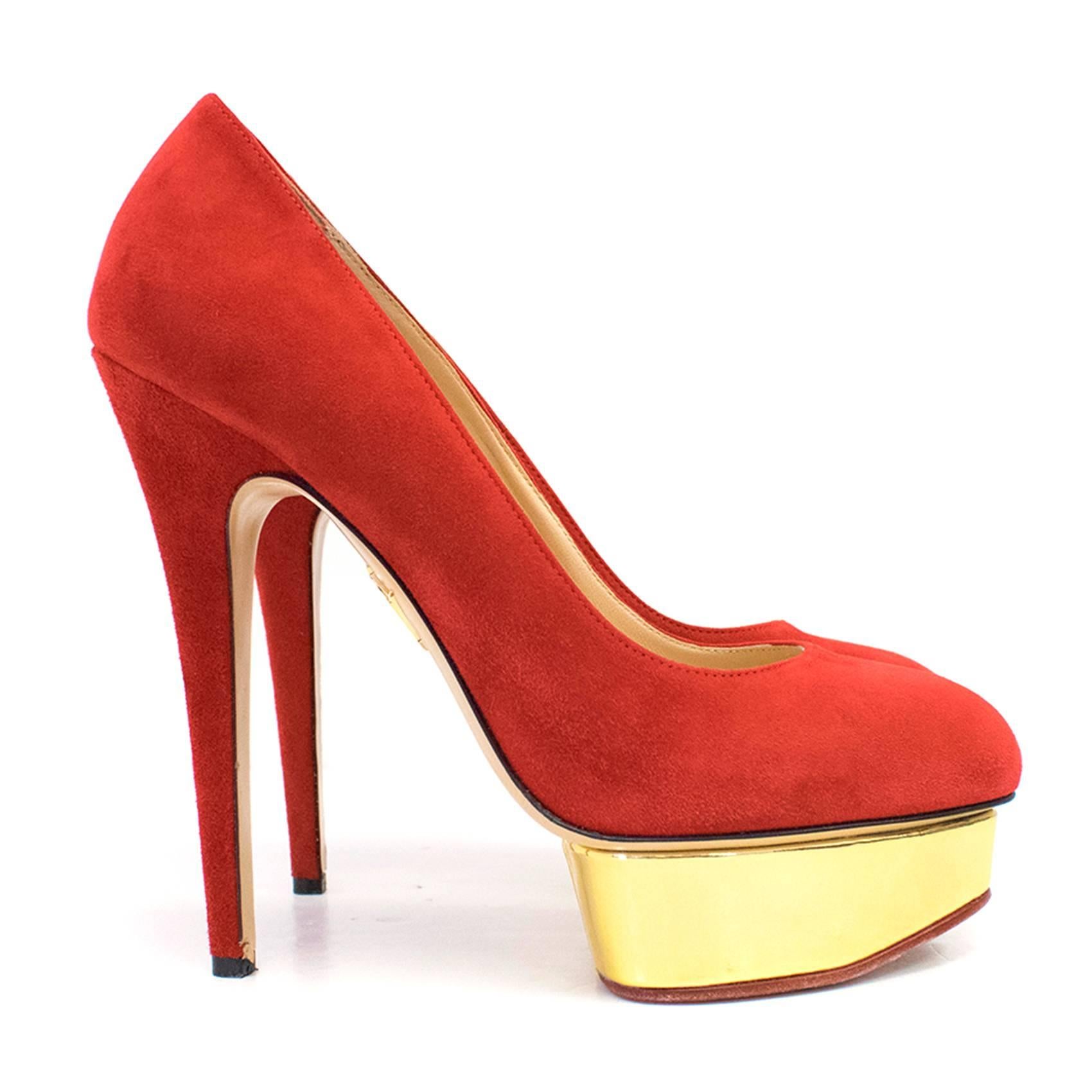 Charlotte Olympia red suede heels in a platform stiletto style featuring a metallic gold accent platform and almond toes. 

Very minor wear at the tip of the heel.
Condition: 9/10

Size IT: 40
Size UK: 7
Size US: 10

Measurements Approx:
length -
