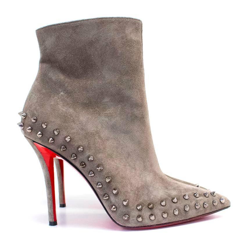 Christian Louboutin taupe suede Willetta 100 spiked ankle boots with a concealed zip on the side and featuring a classic red sole. 

Approx.
length: 28 cm
width: 8 cm
heel: 11 cm

Condition: 9/10
There is normal wear to the soles and some wear to