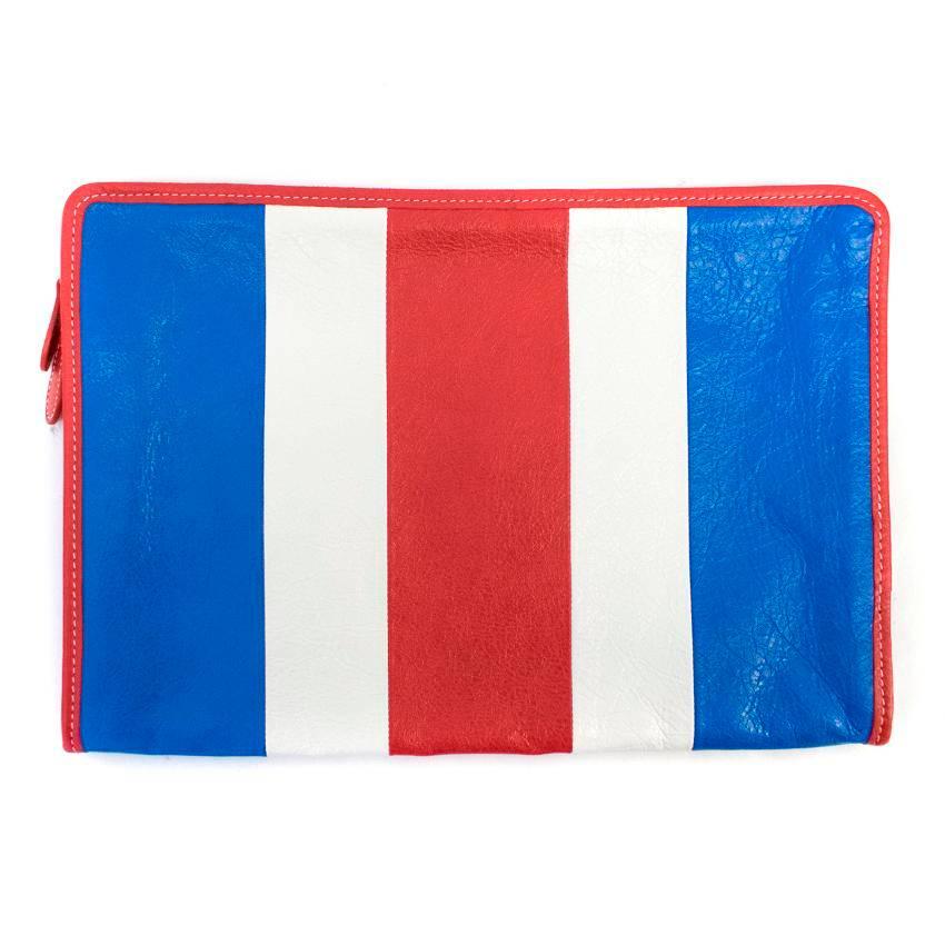 Balenciaga red, white and blue leather clutch bag in a simple rectangle zipped shape featuring a striped design. 

Approx.
width: 34cm
height: 24cm
depth: 2cm

Condition: 10/10