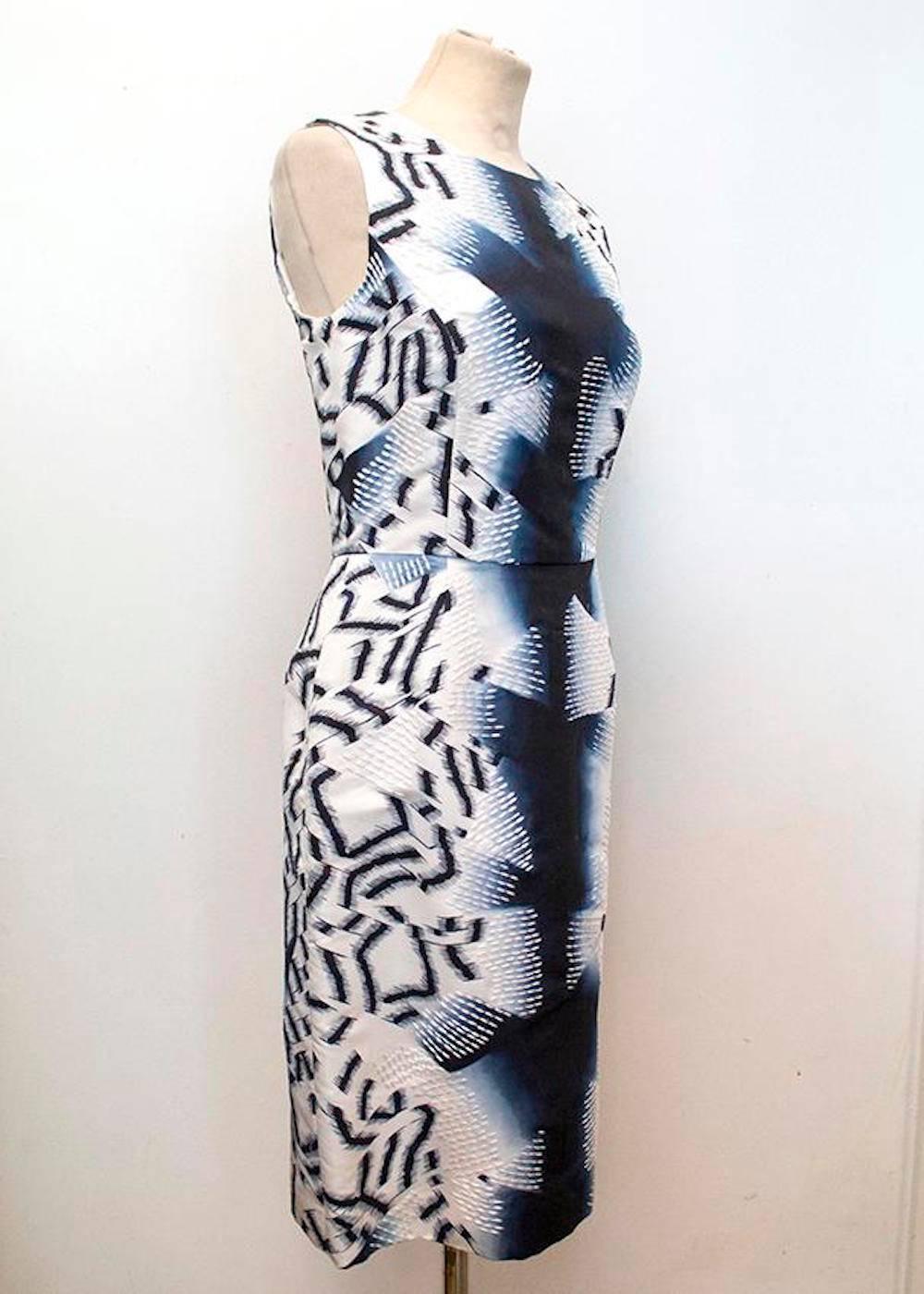 Oscar de la Renta abstract print sleeveless silk dress with white embroidery. Fitted style that is cinched at the waist with soft boat neckline.

- Made in USA
- Dry clean only
- Fully line with internal grosgrain ribbon waist fastening
- Invisible