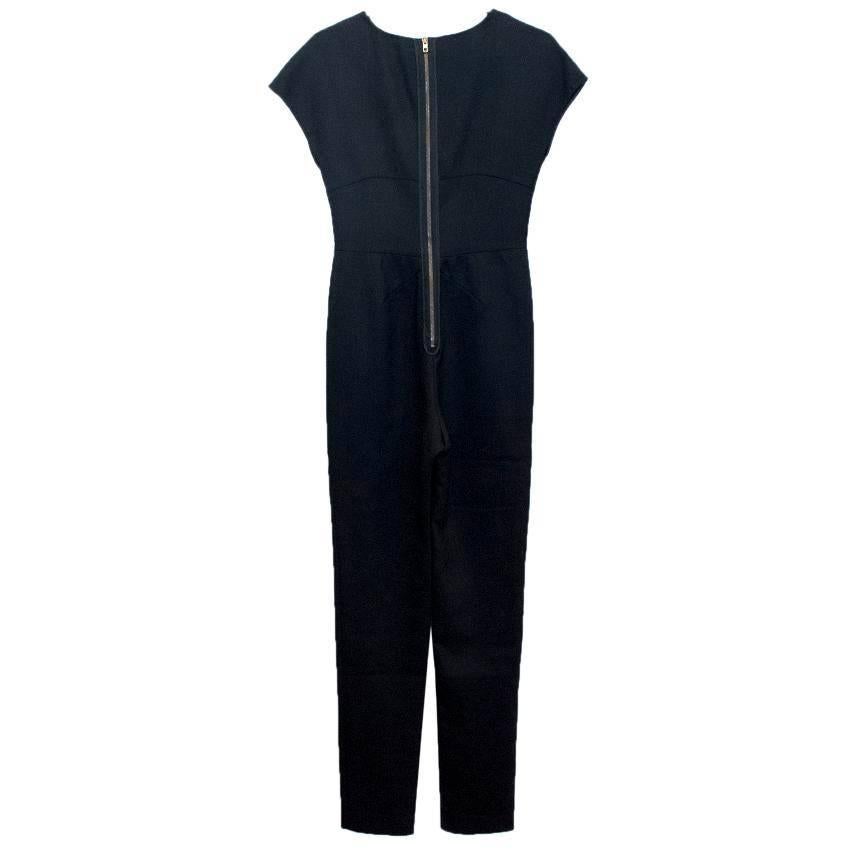 Stella McCartney black, short sleeved jumpsuit with plunging neckline and floral mesh insert. It has a zip closure on the back.

Small pulls to fabric upon close inspection.
9.5/10

Size: 38
Size UK: 6
Size US: 0-2

Measurements Approx:
Shoulders: