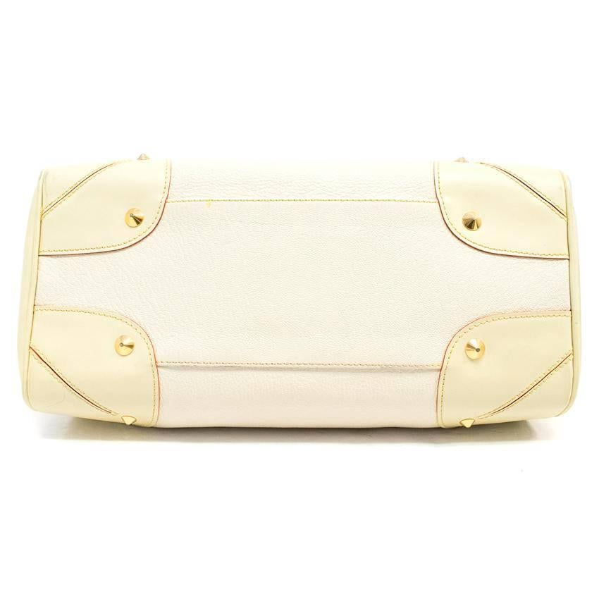 Louis Vuitton cream shoulder bag with a red trim. The interior as one large zipped compartment with 3 side pockets. Features 2 leather handles and gold tone hardware. 

Condition: 9/10 - slight wear on leather, mainly on the base, please see images