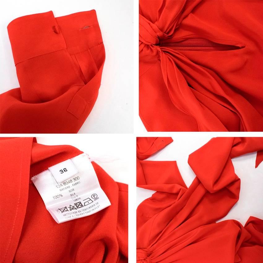 Givenchy red silk long sleeve blouse. Features a high neck with a pussy bow tie, button up cuffs and fastens at the back with a concealed zip. 

This item has been worn once.

Condition: 9.5/10

Size: XS
Size EU: 36
Size UK: 8
Size US: